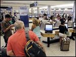  Travelers prepare for check-in.