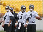  Pittsburgh Steelers quarterbacks John Parker Wilson, (4),  Bruce Gradkowski (5) and Landry Jones (3) line up to start drills during the NFL football practice on today in Pittsburgh. Starting quarterback Ben Roethlisberger had arthroscopic surgery on his right knee Wednesday.