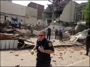 Emergency personnel respond to a building collapse on the edge of downtown Philadelphia on June 5.