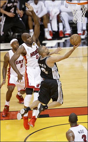 San Antonio point guard Tony Parker scored 21 points and added six assists as the Spurs drove past the Heat in Game 1 of the NBA Finals on Thursday night in Miami.
