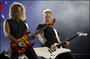 James Hetfield, right, and Kirk Hammett Stuart of Metallica performs during the Rock in Rio music festival in Rio de Janeiro, Brazil.