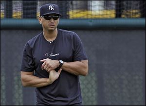 New York Yankees third baseman Alex Rodriguez stretches his wrist during a workout at the Yankees' minor league complex in Tampa, Fla., Wednesday.