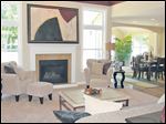 Relax with guests in the great room, where large windows admit abundant sunlight.