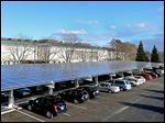  The solar canopy in the Toledo Museum of Art parking lot is in addition to panels on the roof. Along with energy-efficiency measures, they helped the museum create excess power two days.