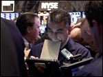  In this Thursday, May 23, 2013, photo, Trader Vincent Quinones, center, works on the floor of the New York Stock Exchange at the close of trading. Steady growth in hiring in May 2013 is sending the stock market sharply higher, Friday, June 7, 2013. (AP Photo/Richard Drew)