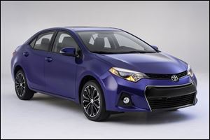 Toyota's new Corolla, revealed Thursday in Santa Monica, Calif., is aimed at shedding a low-cost image and attracting new, younger buyers.