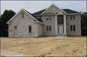 A house in the Country Walk subdivision in Sylvania Township is almost complete. Existing subdivisions are expanding, but new development isn't happening in Lucas County, said Tom Lemon, director of the Toledo-Lucas County Plan Commission. 
