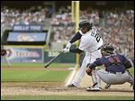  Detroit’s Prince Fielder connects on a three-run double to center off Cleveland pitcher Carlos Carrasco during the second inning.