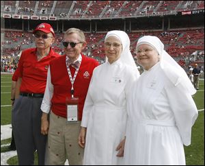 Ohio State President E. Gordon Gee, with Stan Joehlin at left, hosted Sister Cecilia Sartorius and Sister Margaret Banar of Little Sisters of the Poor during a Buckeye football game in 2011 after he apologized for remarks he made about the order. 