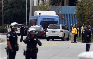 Investigators look at a Santa Monica City Bus that was shot at in Santa Monica.