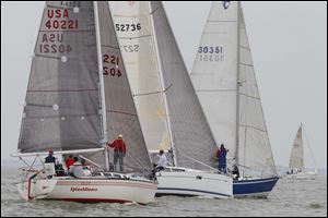 Boats in the PHRF G&H class cross the start line Friday in the Governor's Cup Course of the Mills Trophy Race.