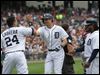  Detroit Tigers Miguel Cabrera, left, and Prince Fielder, right, congratulate Don Kelly after his three-run home run during the sixth inning against the Cleveland Indians on Sunday in Detroit.