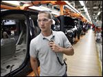  Jeff Caldwell, 29, a chassis assembly line supervisor, monitors the assembly line at the Chrysler Jefferson North Assembly plant in Detroit. The auto industry is on a hiring spree as car makers and parts suppliers race to find engineers, technicians and factory workers to build the next generation of vehicles.