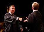  Northview graduate Julius Swolsky smiles as he receives his diploma.
