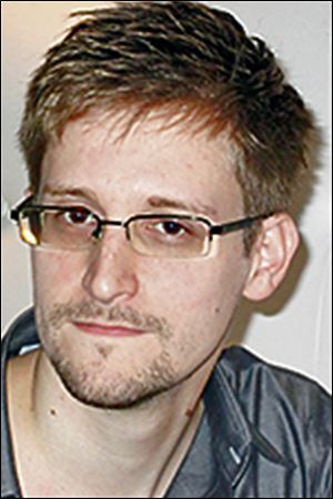 Edward Snowden has flown to Hong Kong and says he is worried for family and friends.