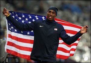 Erik Kynard of the United States celebrates after winning the silver medal in the Men's High Jump Final.