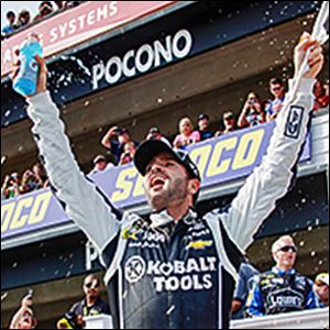 Jimmie Johnson takes the checkered flag to win the Pocono 400. Johnson led 128 of 160 laps in the race to continue to stretch his lead in the Sprint Cup standings.