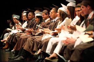 Southview graduates clap their hands during the high school's commencement ceremony.