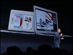  Phil Schiller the senior vice president of worldwide marketing at Apple introduces the new MacBook Air laptops during the keynote address of the Apple Worldwide Developers Conference  in San Francisco today.