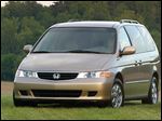  U.S. safety regulators have added about 320,000 older model Honda Odyssey minivans to a widening probe of faulty air bags.