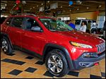  A 2014 Jeep Cherokee Trailhawk is displayed at Charlie’s Dodge in Maumee. One expert predicts sales of 80,000 to 100,000 Cherokees a year in the United States. 