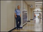 Lake High School Principal Lee Herman stands in the hallway where an open entranceway will lead into an unfinished part of the high school that will be turned into six classrooms. 
