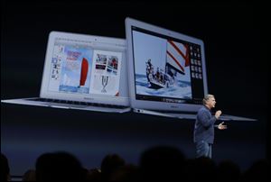 Phil Schiller the senior vice president of worldwide marketing at Apple introduces the new MacBook Air laptops during the keynote address of the Apple Worldwide Developers Conference  in San Francisco today.