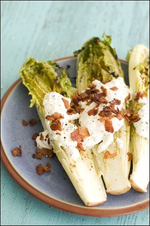 Grilled hearts of romaine with blue cheese dressing.