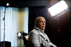 Actor John Malkovich speaks with media Thursday at the King Edward Hotel in Toronto to promote his new role as Casanova in The Giacomo Variations. That same day, a Defiance man’s cross-country Canadian tour almost turned tragic when he fell walking on a Toronto sidewalk and a protrusion sticking out of the construction scaffolding slit his throat. Rescue came from an unlikely source: Malkovich.