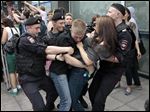  Police officers detain gay rights activists as they gathered near the State Duma, Russia's lower parliament chamber, in Moscow, Russia, today in protest.