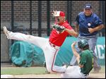  Bedford’s Jakob Letson, left, can’t get the tag down as Howell’s Patrick O’Brien steals third base. The Mules’ season came to an end Tuesday with a loss in the Division 1 state quarterfinals.