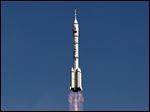  A bird flies as the Long March 2F rocket carrying the Shenzhou 10 capsule blasts off from the Jiuquan Satellite Launch Center in Jiuquan, northwest China's Gansu Province, today.