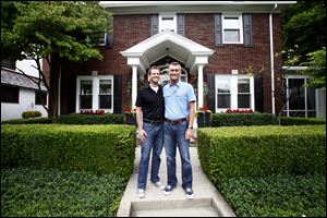 Steve Gola, right, and Robert Beckwith at their home in Toledo.