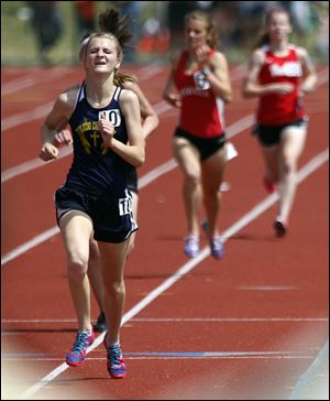 Toledo Christian senior Delainey Phelps runs wins the 3200-meter race in the Division III state meet.