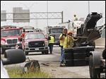  Fire scorched the pavement after the crash on I-75 in North Toledo, but even more damage was caused by unburned fuel soaking into the asphalt and changing its chemical structure. 
