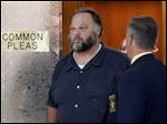  Andrew Gustafson leaves Lucas County Common Pleas Court following his arraignment early today.