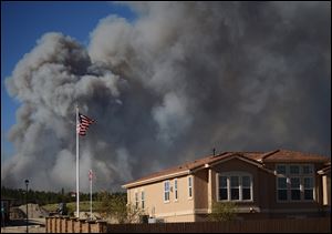 The Black Forest Fire burns northeast of Colorado Springs, Colo, Tuesday.