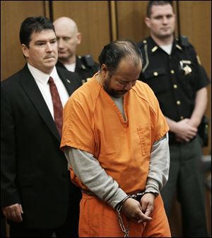 Ariel Castro walks into the courtroom during his arraignment today in Cleveland.  Castro, 52, is accused of holding three women captive in his Cleveland home for about a decade.