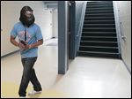  Jesse Duckworth, assistant principal at Bowsher High School, takes the role of shooter in an exercise at Woodward High School on Thursday.  In­stead of lock­ing rooms and hid­ing, school staff learn to re­act to an intrusion based on pre­sented in­for­ma­tion. Eventually students will receive training.