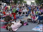  Michelle Zigray of Sylvania, and her son Steven Zigray, 9,  along with her daughter Julia, 10, watch 