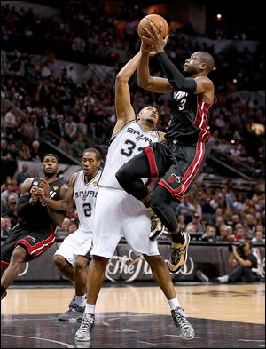 Miami's Dwyane Wade shoots over San Antonio's Boris Diaw is Thursday night's Game 4 of the NBA Finals. Wade finished with 32 points, six rebounds, and six steals.