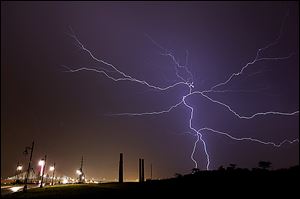 Bolts of lightning fill the sky as severe storms move through the Toledo area Late Thursday shortly before midnight.
