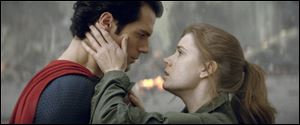 Henry Cavill as Superman, left, and Amy Adams as Lois Lane in 