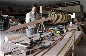 John Riddle works to build a replica of the longboat used by Comm. Oliver Hazard Perry during the Battle of Lake Erie in 1813 off Put-in-Bay. The pulling boat will be christened Saturday in Sandusky.