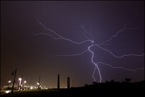 Bolts of lightning fill the sky as severe storms move through the Toledo area about midnight Wednesday.
