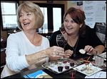  Patty Pastorek, left, of Oregon enjoys a glass of wine with daughter Kara Pastorek of Sylvania at Chateau Tebeau Winery.