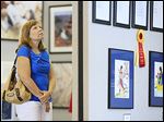  Amy Fell of Sylvania views the Art-A-Fair exhibit, which features more than 200 pieces by local artists.