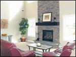  The great room’s stone fireplace rises two stories, making a grand statement. 
