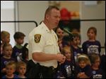  Sylvania police officer and Safety City program director Sergeant Justin Music talks about the program to help children be safer at the graduation ceremony.