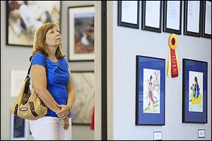 Amy Fell of Sylvania views the Art-A-Fair exhibit, which features more than 200 pieces by local artists.